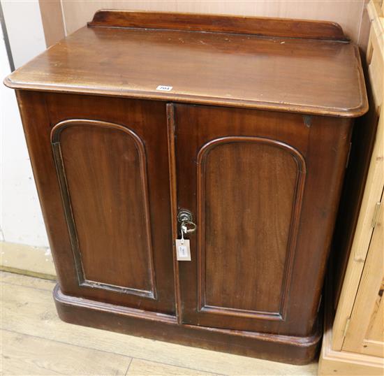 A Victorian mahogany cupboard enclosed by a pair of panelled doors, W.84cm